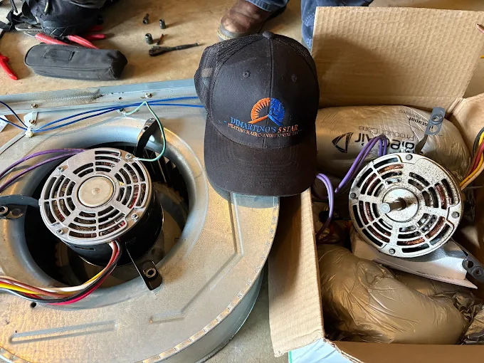 Professional HVAC fan motors and equipment used by DiMartino's certified technicians for AC repairs DiMartino's professional HVAC equipment and fan motors with company hat showing quality AC repair service in Salem Oregon